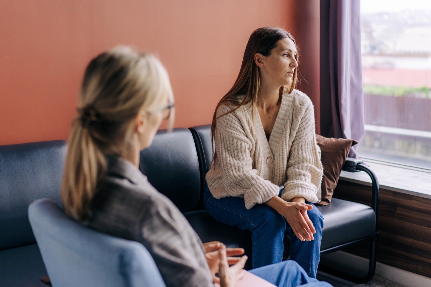 A therapist and client talking during a session
